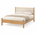 Cama doble de madera con cabecero tapizado beige