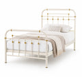 Cama de acero crema con detalles dorados